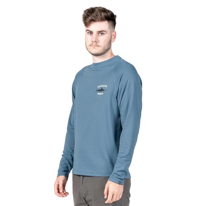 A male model wearing a long-sleeved blue t-shirt with a graphic print on the chest, standing against a white background. The t-shirt is advertised for its quick drying and UPF 30+ properties.