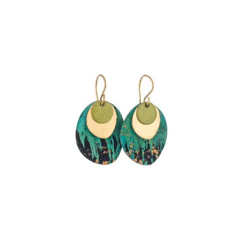 Pair of Sibilia Rock Earrings in Forest, featuring a small matte gold crescent-shaped disc layered over a large oval treated brass drop with a dramatic forest green, teal, black, and gold speckle oxide patina finish, on gold wire hooks, on a white background