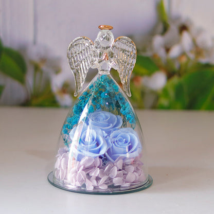 Glass angel figurine with rose arrangement presented for a shelf or desk, with the decorative structure clearly viewed today.
