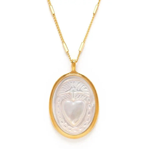 Gold necklace with a heart-shaped pendant on a white background