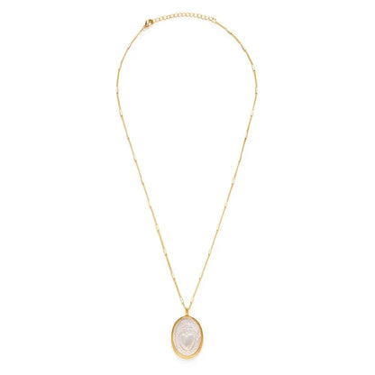 Gold necklace with a pendant on a white background