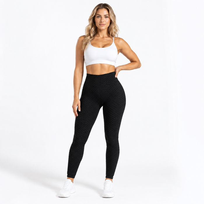 Scrunch leggings women in black shown from the front on an adult model, with high waist and textured activewear finish.