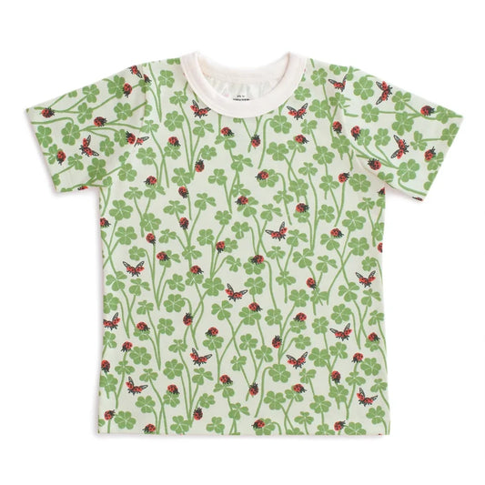 T-shirt with a pattern of red ladybugs and green leaves on a white background