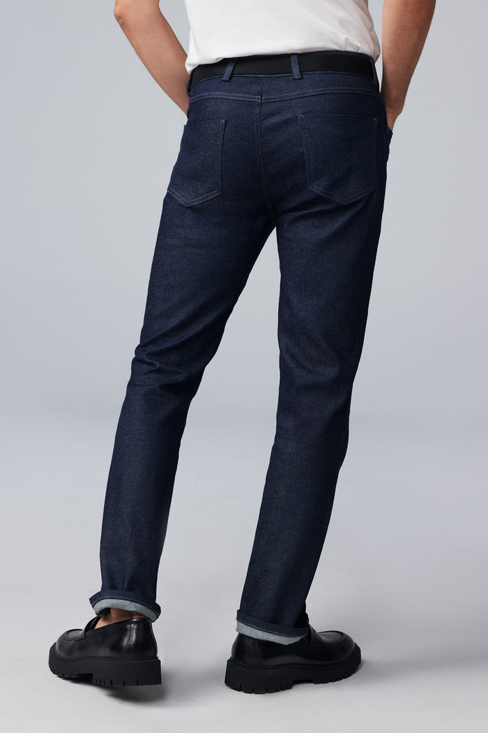 Back view of man wearing SILVER Denim in Dark Indigo Rinse