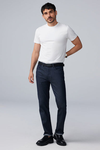 Full body front view of man wearing SILVER Denim in Dark Indigo Rinse