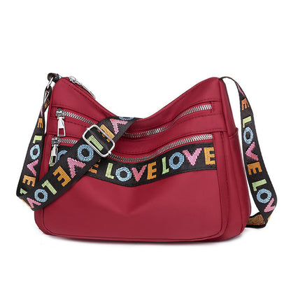 Expansive Red Oxford Cloth Crossbody Bag: Single Strap for Hands-Free Convenience