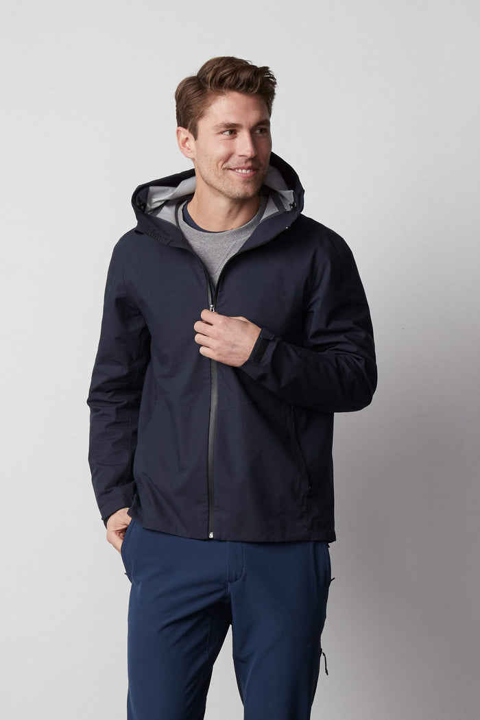 Front view of a man wearing Stormchaser Jacket in Total Eclipse
