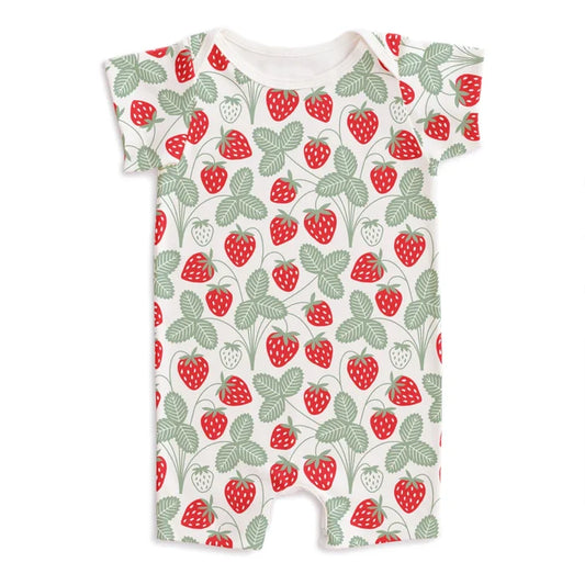 Summer romper in a red and green strawberry print on a whitebackground