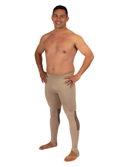 Shirtless male model wearing Waihana Tan Carvico Lycra spearfishing leggings with reinforced knee panels and ankle stirrups, shown from the front on a white studio background.