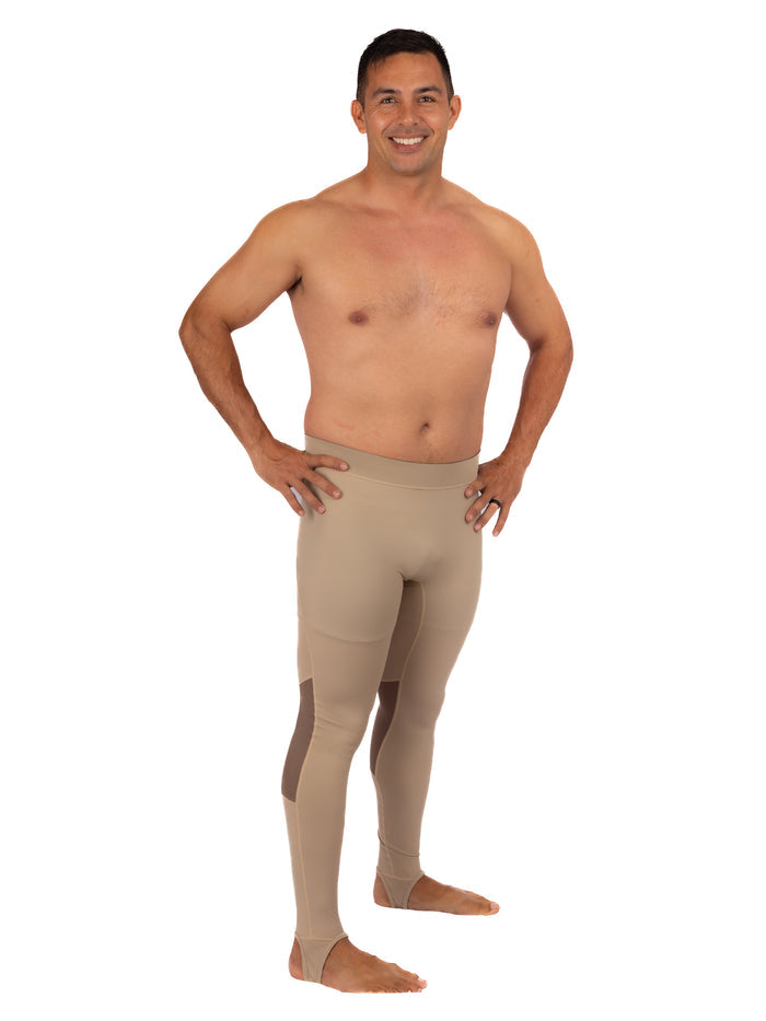 Smiling man wearing Waihana Tan Carvico Lycra leggings with contrast knee panels and ankle stirrups, shown from the front against a white background.