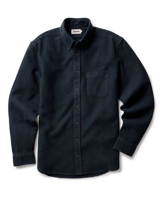 Taylor Stitch Jack Shirt in Forest Waffle, flat lay front view showing dark forest green waffle-knit fabric, button-down collar, chest pocket, and lock-stitched buttons on white background