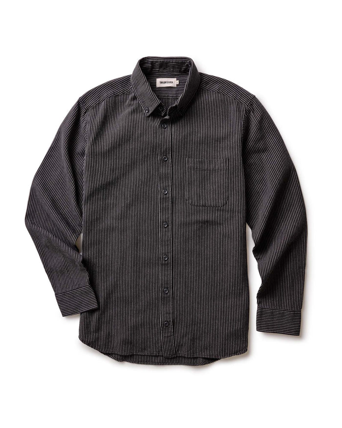 The Jack in Roped Black Indigo by Taylor Stitch, flat lay front view showing full shirt silhouette, button-down collar, chest pocket, and long sleeves