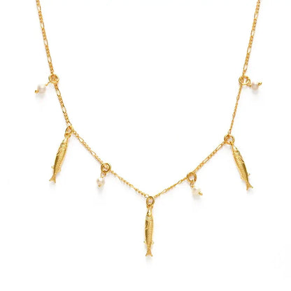 Gold necklace with fish and pearl charms on a white background
