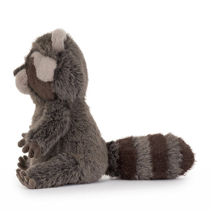 Plush raccoon toy on a white background as seen from the side