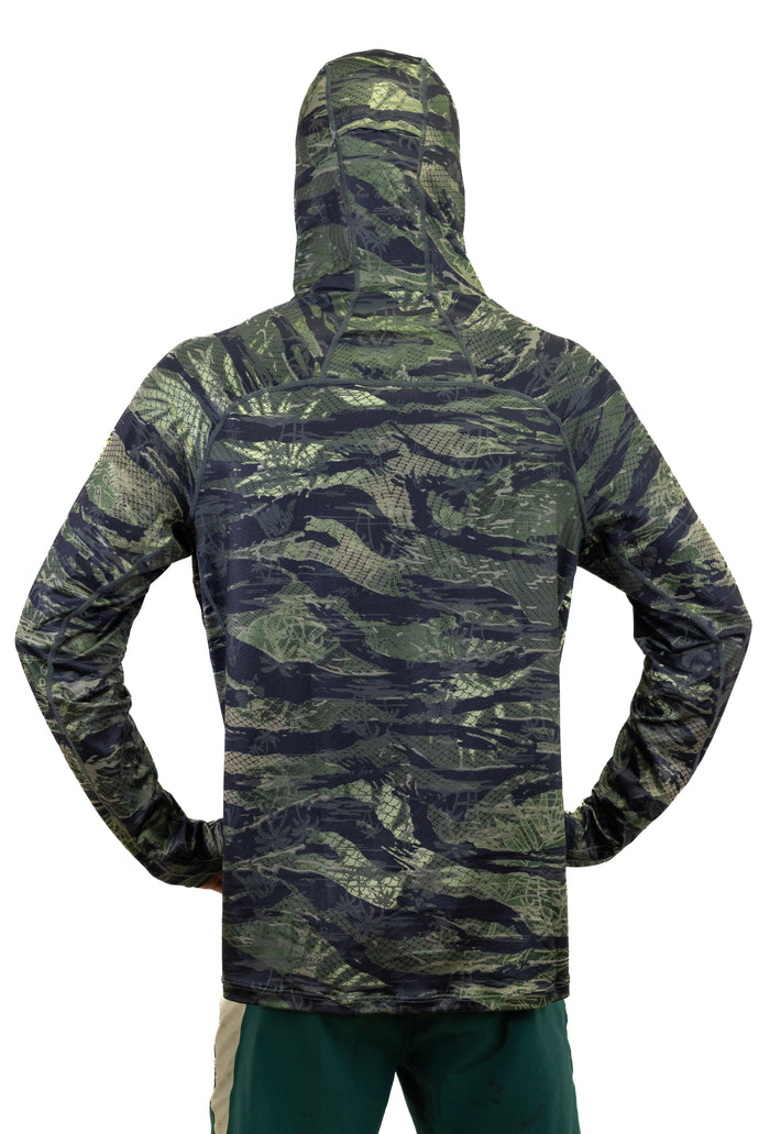 Back view of a man wearing the Waihana Tropicam Sun Shirt, a long-sleeve hooded rashguard in a green and black camouflage pattern, shown against a white background.