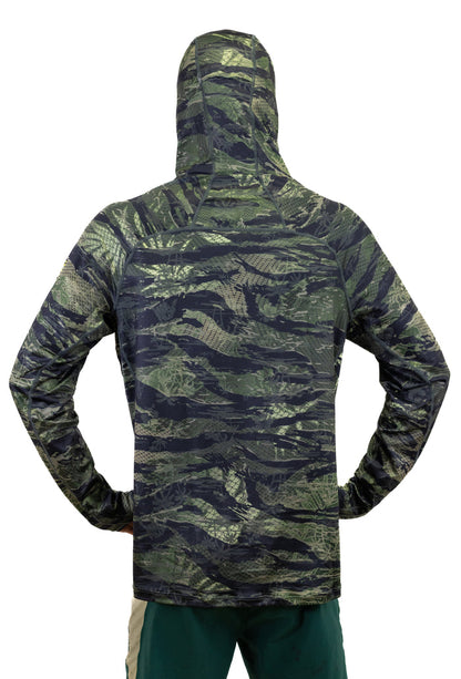 Back view of a man wearing the Waihana Tropicam Sun Shirt, a long-sleeve hooded rashguard in a green and black camouflage pattern, shown against a white background.