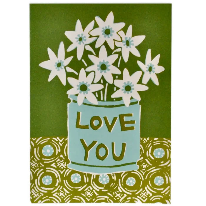 A greeting card with a floral design and the text 'Love you' in a blue pot, against a green background with a geometric pattern.