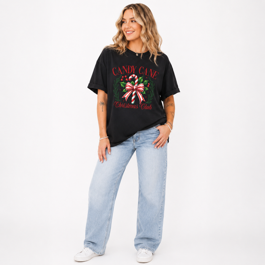 Women's Christmas T shirt with candy cane graphic, and oversized relaxed fit for holiday parties, gift swaps and casual wear.