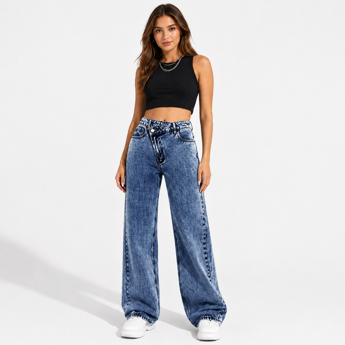 Women's high waisted wide leg jeans in medium blue wash, front view showing crossover waist and full wide leg silhouette.