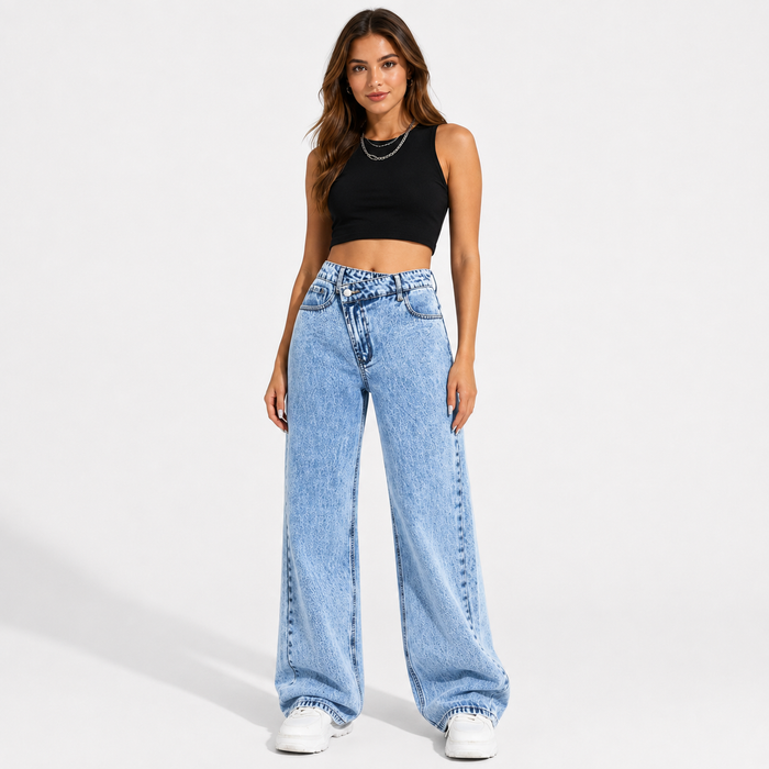 Women's high waisted wide leg jeans in light blue wash, full front view with crossover waist on a white studio background.