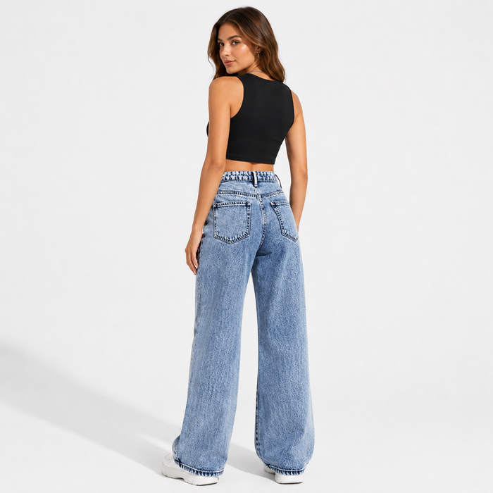 Women's high waisted wide leg jeans in light blue wash, back view showing rear pockets and wide leg shape on a model.