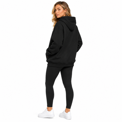 Side view of women's oversized hoodie showing a relaxed fit, hood, long sleeves and pocket detail for casual everyday outfits