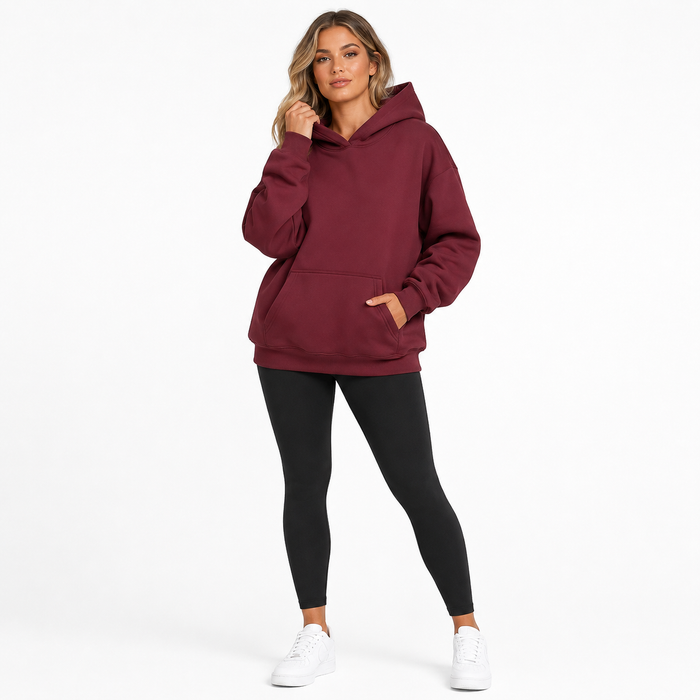 Women's solid oversized sweatshirt hoodie with pockets, regular long sleeves and a loose fit for comfortable casual layering.