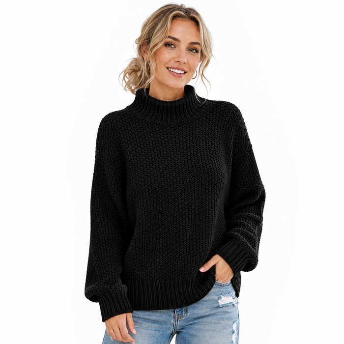 Women's black turtleneck sweater on model with textured knit, ribbed neckline, cuffs and hem on a clean white background.