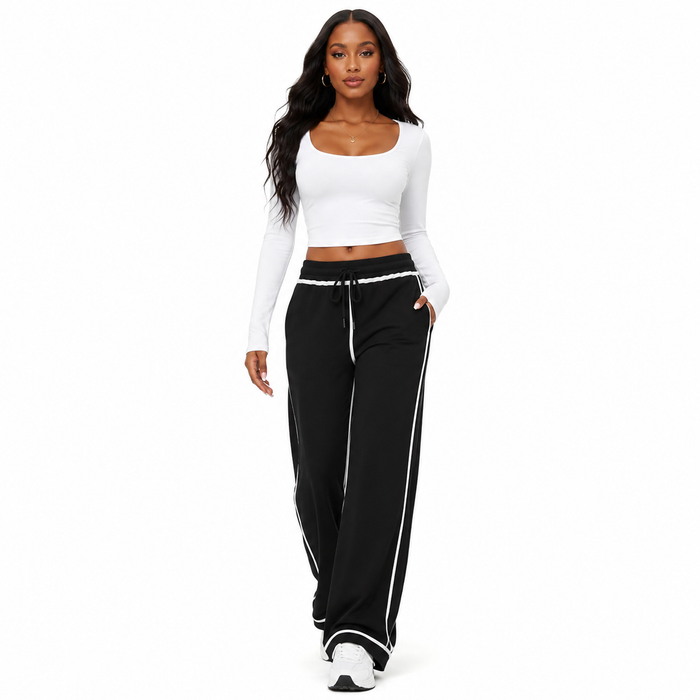 Women's casual lounge trousers with an elastic high waist, wide leg cut, and soft cotton fabric for refined off-duty styling.